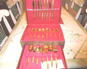 Gold Electroplated 55 Piece Flatware. Service for 8, and 7 Serving Pieces lower drawer. Wm. Rogers, International Silver Golden Charm.