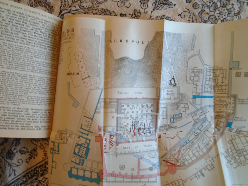 May include: A black and white map of the Acropolis in Athens, Greece. The map shows the location of the Museum, the Temple of Athena Nike, the Propylaea, the Erechtheum, and the Parthenon. The map is labeled "ACROPOLIS" in large letters.