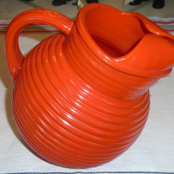 Retro Ball Pitcher, Orange / Red Ribbed Tilted Ball Pitcher.  1950-60s. Eye catching Retro Pitcher. 6" tall  x 6.5" wide, holds 5 c. liquid.
