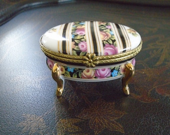 Oval Trinket Box, Porcelain Hinged Jewlery Box. Ribbons of Roses with  Black and Gold between, Rose Ribbon around with Gold legs.