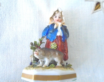 Capodimonte Peasant Girl Looking down, detailed fingers on hands in back. White tattered scarf, Blue Jacket, Red Skirt w/green patch