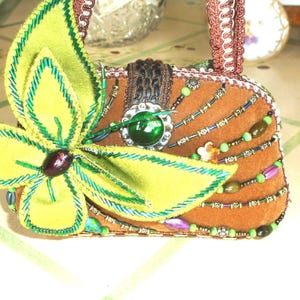 May include: A set of three ceramic mugs with a speckled, matte finish. The mugs are in shades of cream, light gray, and dark gray. Each mug has a simple, minimalist design and a rounded handle.