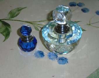 Perfume Bottle by Badash. Large Clear Faceted Sphere Aqua coloring in different lighting, or Deep Blue. The toppers are screw top daubers.