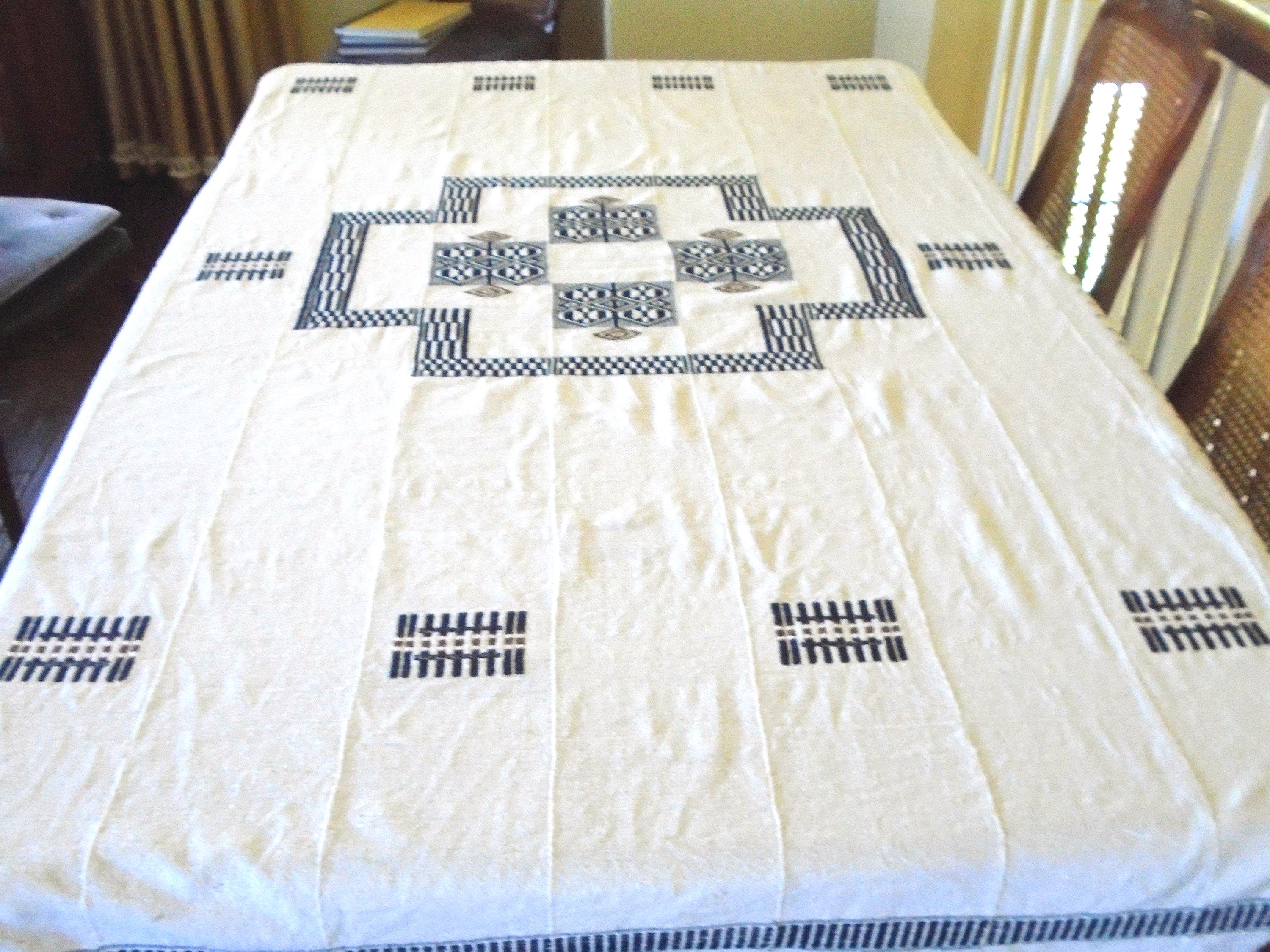 African Hand woven Tablecloth, Made in Ivory Coast Africa, 80" x 52". Ivory background with Blue and Brown Motif.