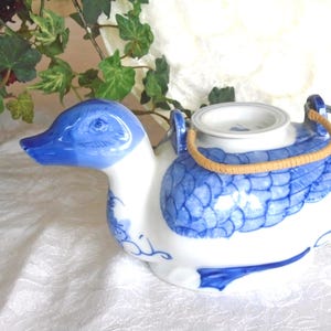 DUCK shaped Teapot, Delightful Blue and White Duck. Ceramic, Hand Painted, White and Blue, 8.25" Length, 4.25" Height. Made in China