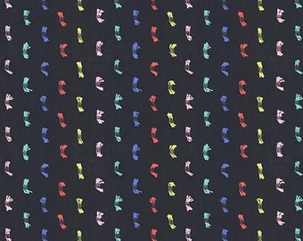 May include: Black fabric with a repeating pattern of colourful brushstrokes. The fabric is marked with a ruler in inches and the text "RUBY STAR SOCIETY".