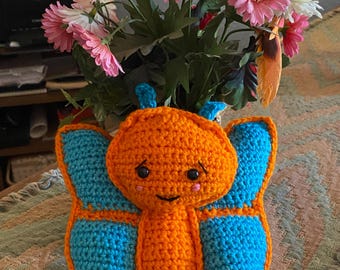 Crocheted butterfly toy, aqua and orange