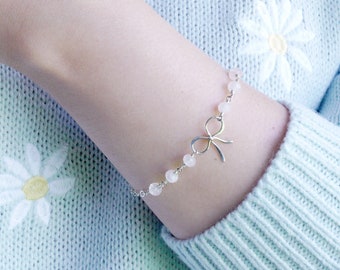 Beaded Rose Quartz Bow Bracelet: sterling silver ribbon charm, love crystal gemstone bead, cute dainty minimal, gift for daughter, friend