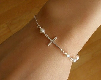 Dainty cross bracelet in sterling silver with white round pearl beads for women and teen girls. Elegant, simple, layering minimalist jewelry