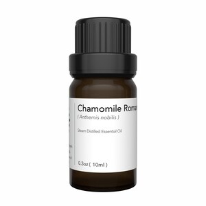 May include: A small, brown glass bottle of chamomile essential oil with a black cap. The label reads "Chamomile Roman (Anthemis nobilis) Steam Distilled Essential Oil" and indicates a volume of 0.3 oz (10ml).
