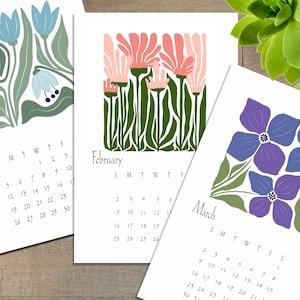 Calendario actualizado 2026, moderno calendario retro de flores para escritorio o pared. Disponible con o sin caballete negro de 18 x 11,4 cm.