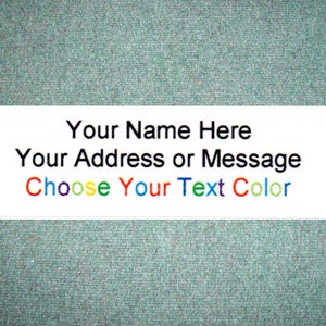 May include: A white rectangular sticker with black text that reads "Your Name Here", "Your Address or Message", and "Choose Your Text Color". The text "Choose Your Text Color" is in multiple colors.