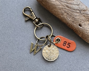 85th birthday gift, 1939 British threepence coin with a choice of initial and number 85 leather tag with keyring or clip fastening