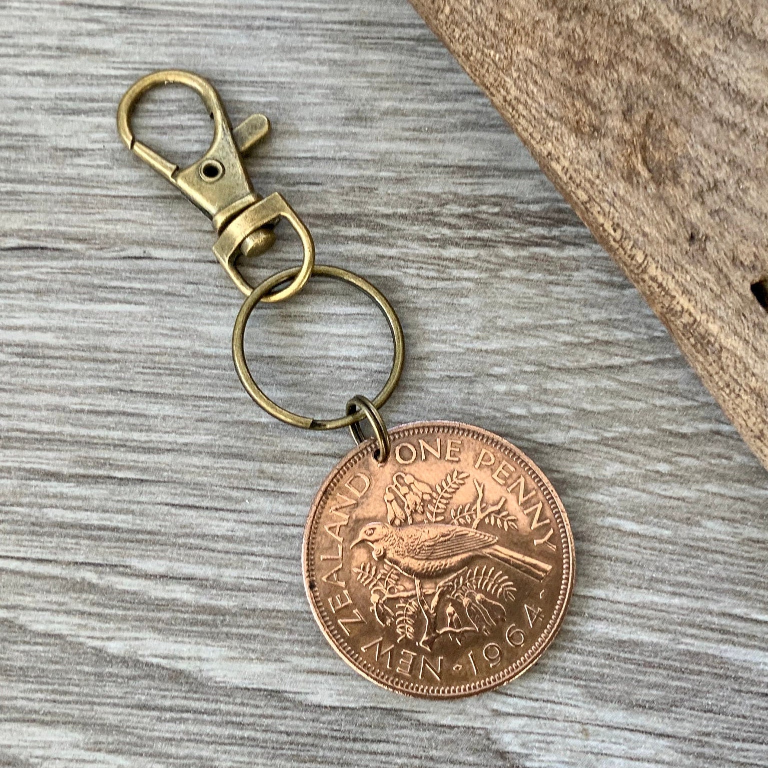 1964 New Zealand penny keyring, keychain, or clip, NZ Tui bird coin a