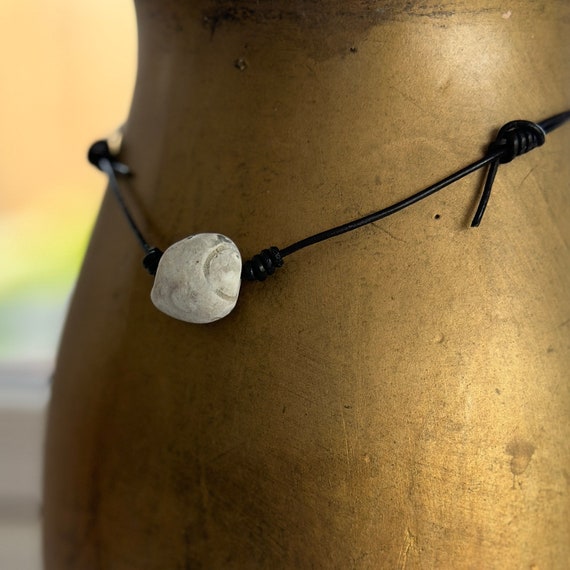 Hag stone pendant, raw stone necklace, beach rock jewellery, black leather cord, knotted necklace, adjustable length