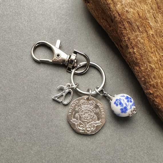 China anniversary gift, 20th Anniversary gift, 2004 British twenty pence coin keyring or clip with a china bead charm,