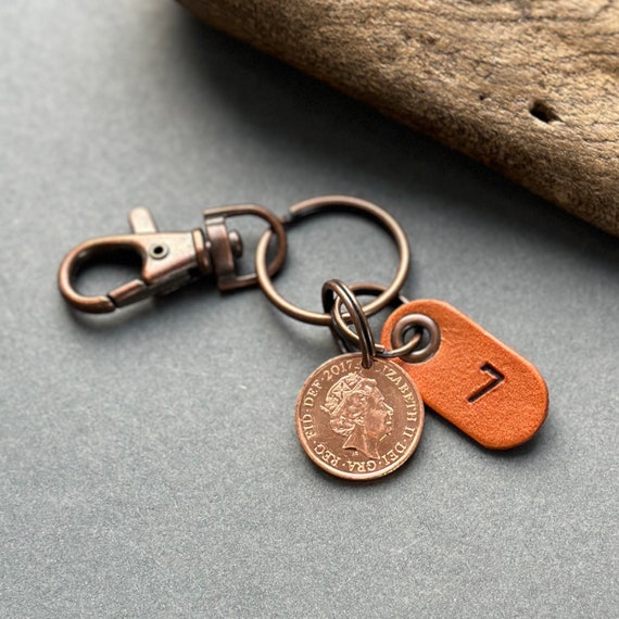 7th anniversary gift, 2017 penny, one pence coin keyring or clip with a leather number 7 tag, British 1p coin