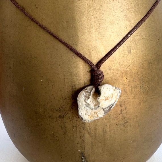 Hag stone pendant, raw stone necklace, beach rock jewellery, brown waxed cotton cord, knotted necklace, adjustable length, pebble pendant