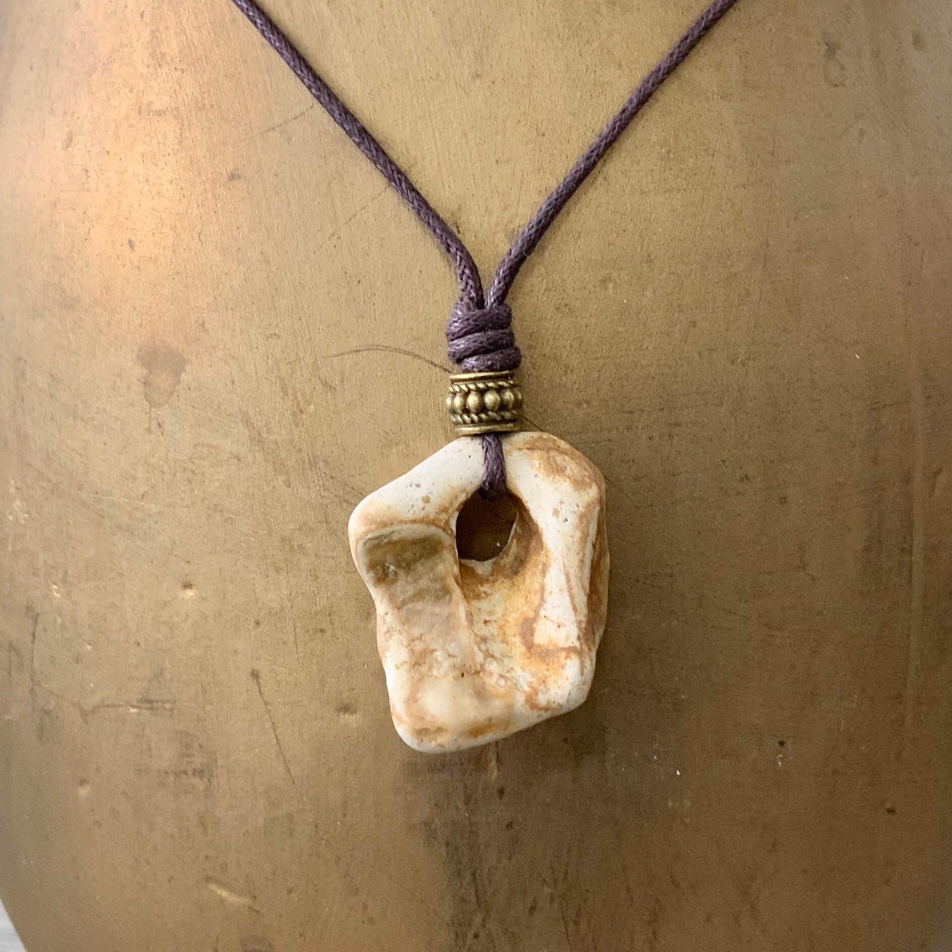 Hag stone pendant with a brown cotton cord, raw stone necklace, beach