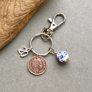 20th Anniversary gift, 2004 British penny coin keyring with a china bead charm to represent the China anniversary