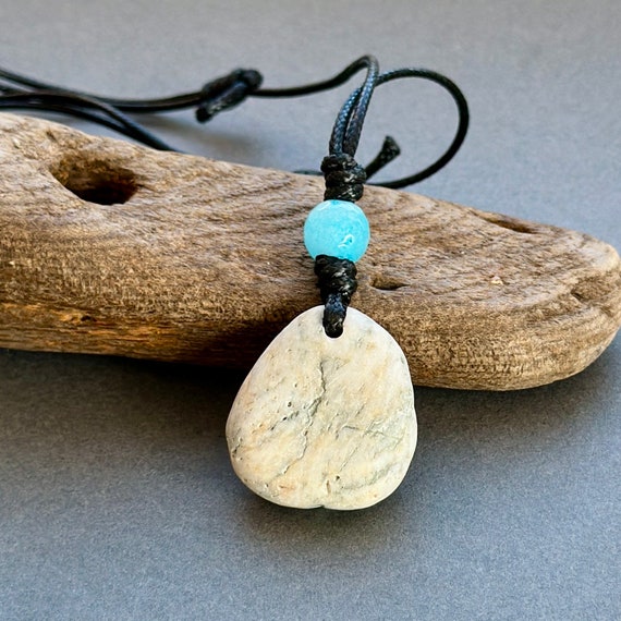 beach pebble pendant necklace with an aquamarine bead natural no metal jewellery on an adjustable black polyester cord