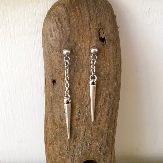 Mismatched spike earrings, a pair of asymmetrical stud post earrings, silver colour spike jewellery for men or women