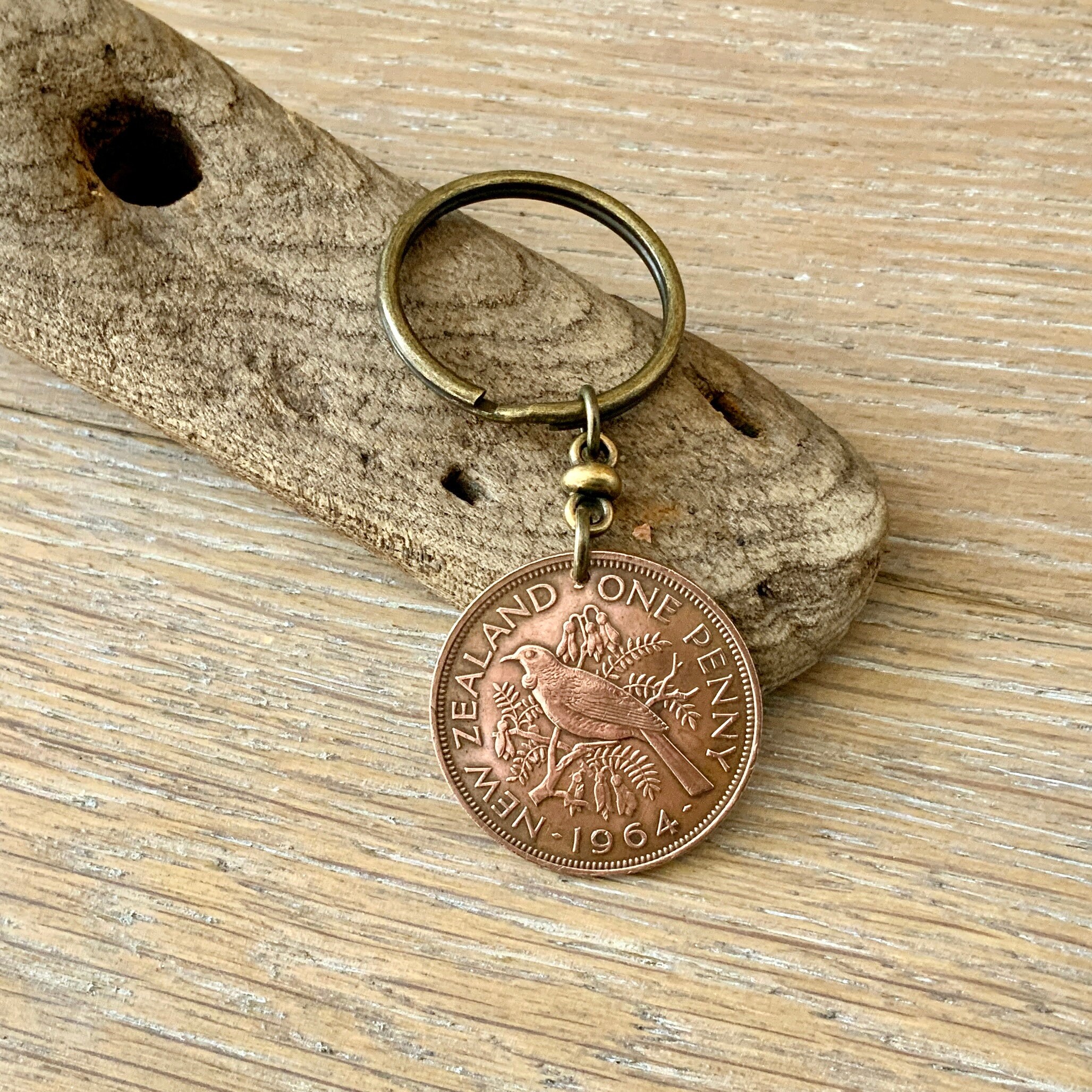 1964 New Zealand penny keyring, keychain, or clip, NZ Tui bird coin a