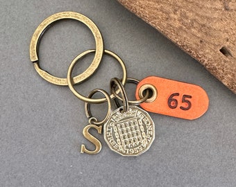 1959 British threepence with a handmade leather 65 tag, a perfect 65th birthday gift, choose between a keyring or clip