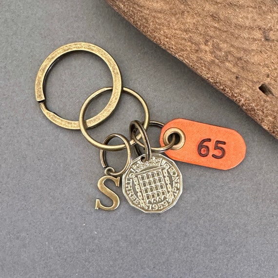 1959 British threepence with a handmade leather 65 tag, a perfect 65th birthday gift, choose between a keyring or clip