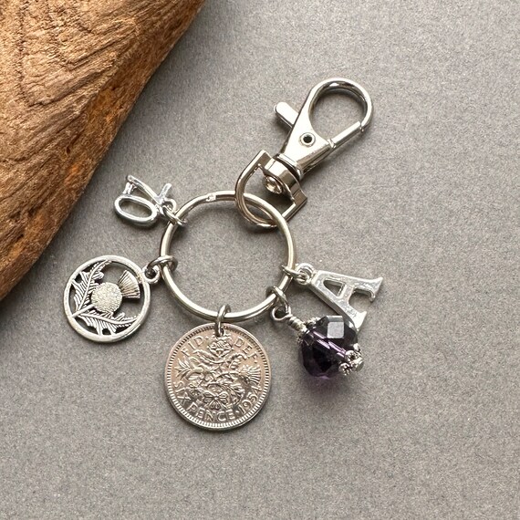 Scottish 70th personalised birthday gift, 1954 sixpence with a thistle charm, bag charm clip, choose initial and birthstone colour,