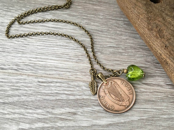 1943 Irish half penny coin necklace with a green glass heart and bronze feather charm, genuine vintage coin from Ireland, 81st birthday gift