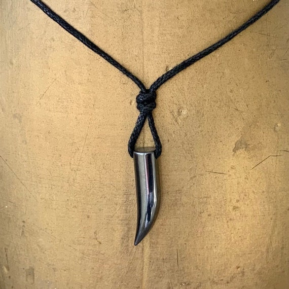 Tusk pendant necklace, with an adjustable black cotton  cord, hematite boho jewellery