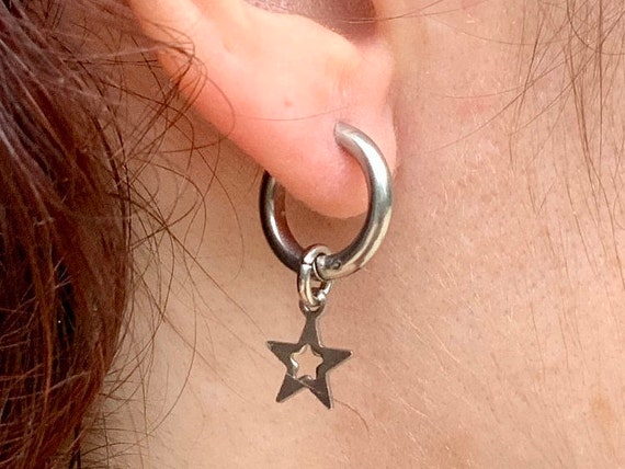 Thick hoop star stainless steel earring with a hinge and latch closure, available as single earring or a pair earrings