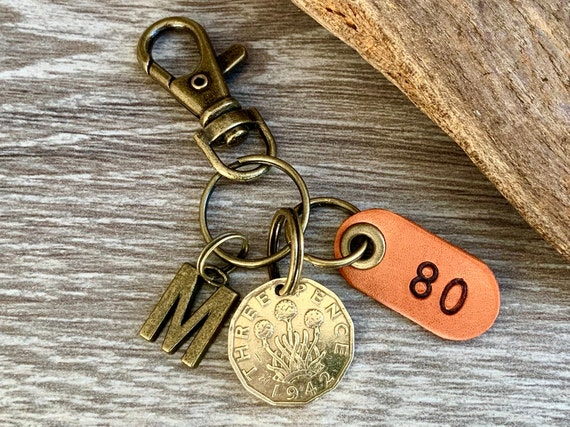 80th birthday gift, 1942 British threepence coin with a choice of initial and number 80 leather tag with keyring or clip fastening