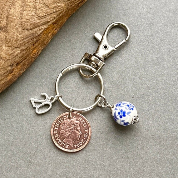 20th birthday or Anniversary gift, 2004 British penny coin key ring clip with a china bead charm to represent the China anniversary