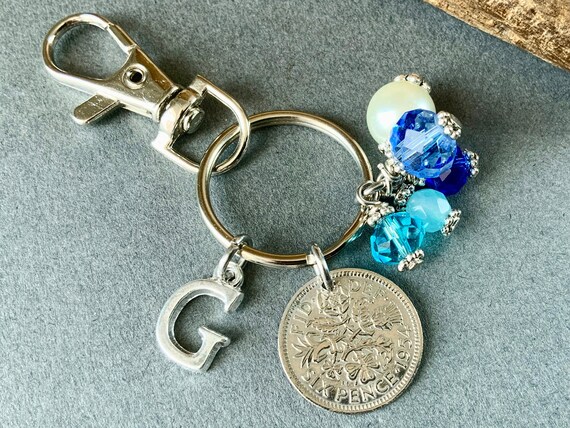 Sixpence with a blue beaded charm bag clip, choose initial and coin year for a thoughtful birthday or anniversary gift