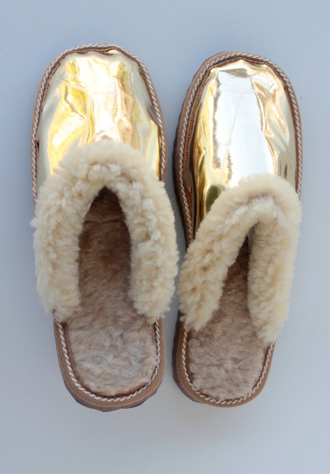 gold and white slippers