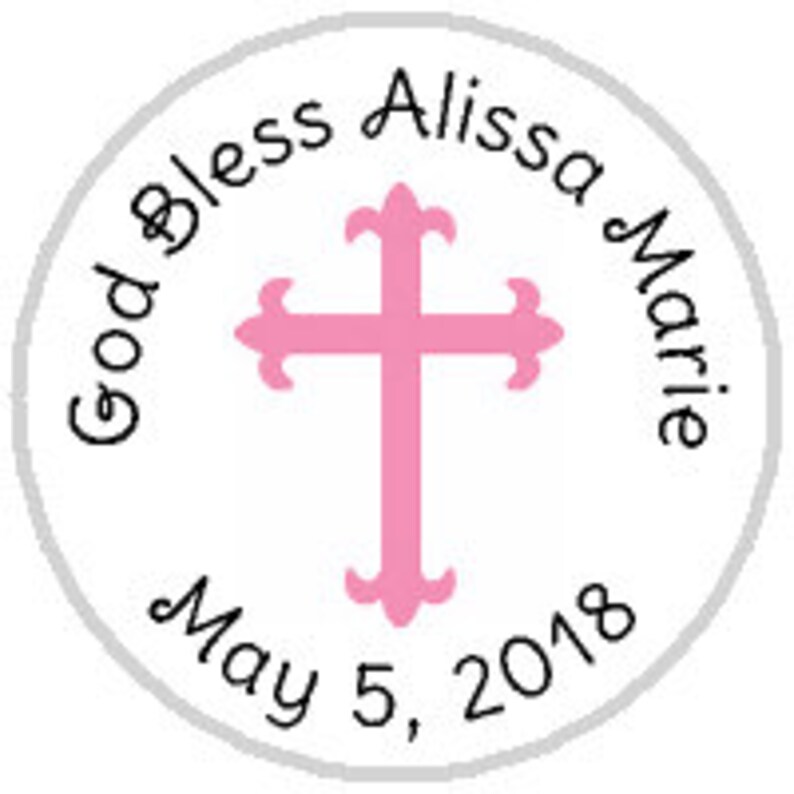 May include: A white circle with a gray border, featuring a pink cross with decorative flourishes. The text "God Bless Alissa Marie May 5, 2018" is written around the cross.
