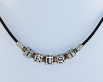 On sale : "TRUST" in sterling silver, copper, brass and leather men or women, unisex wire wrapped necklace, valentine