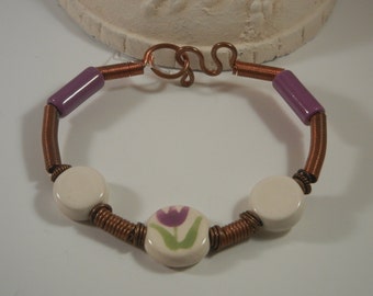 Hand wire wrapped, purple and white floral ceramic copper bangle bracelet