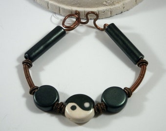 Hand wire wrapped, green and white yin yang ceramic copper bangle bracelet