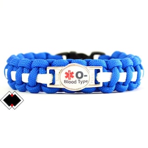 May include: Blue and white paracord bracelet with a silver buckle and a round tag that says "O- Blood Type" with a red medical symbol.