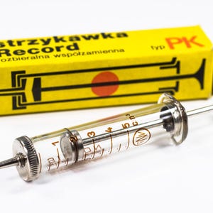 Old syringe, Glass syringe, Vintage medicine, Medical tools, Old medicine, Medical syringe, Vintage medical tools, Old medical accessories.