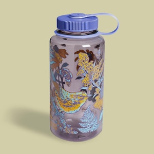 May include: A clear water bottle with a blue lid and a matching handle. The bottle features a colorful design of a bird, butterflies, and floral elements in yellow, blue, and brown. The bottle is designed for outdoor use.