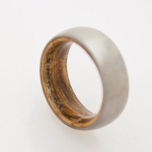 titanium wedding band with inner wood comfort fit inside wood band