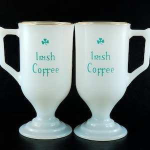 Two Irish Coffee Mugs with Pedestal Base, Vintage Translucent Milk Glass with Gold Tone Trim and Soft Green Lettering, 5.5 Inches Tall