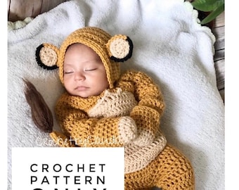 May include: Crochet pattern for a baby lion costume, 0-3 months. The pattern includes a hat, a jumpsuit, and a tail. The pattern is not a finished costume.
