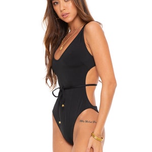 APOLLO Black low-back strappy cutout swimsuit. Tie waist one-piece bodysuit. Plunge V body with low open back. Sexy festival outfit for her.