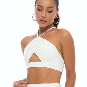 Zalia white sexy cropped party top with a strappy open back. Ruched cross-back crop top for festival, club & party. Halterneck clubwear top.