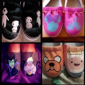 May include: Four pairs of shoes with hand-painted designs. The first pair is black with white cartoon characters. The second pair is pink with gold studs and cartoon characters. The third pair is brown with a cartoon character from the movie "The Little Mermaid". The fourth pair is orange and white with cartoon characters from the show "Adventure Time".